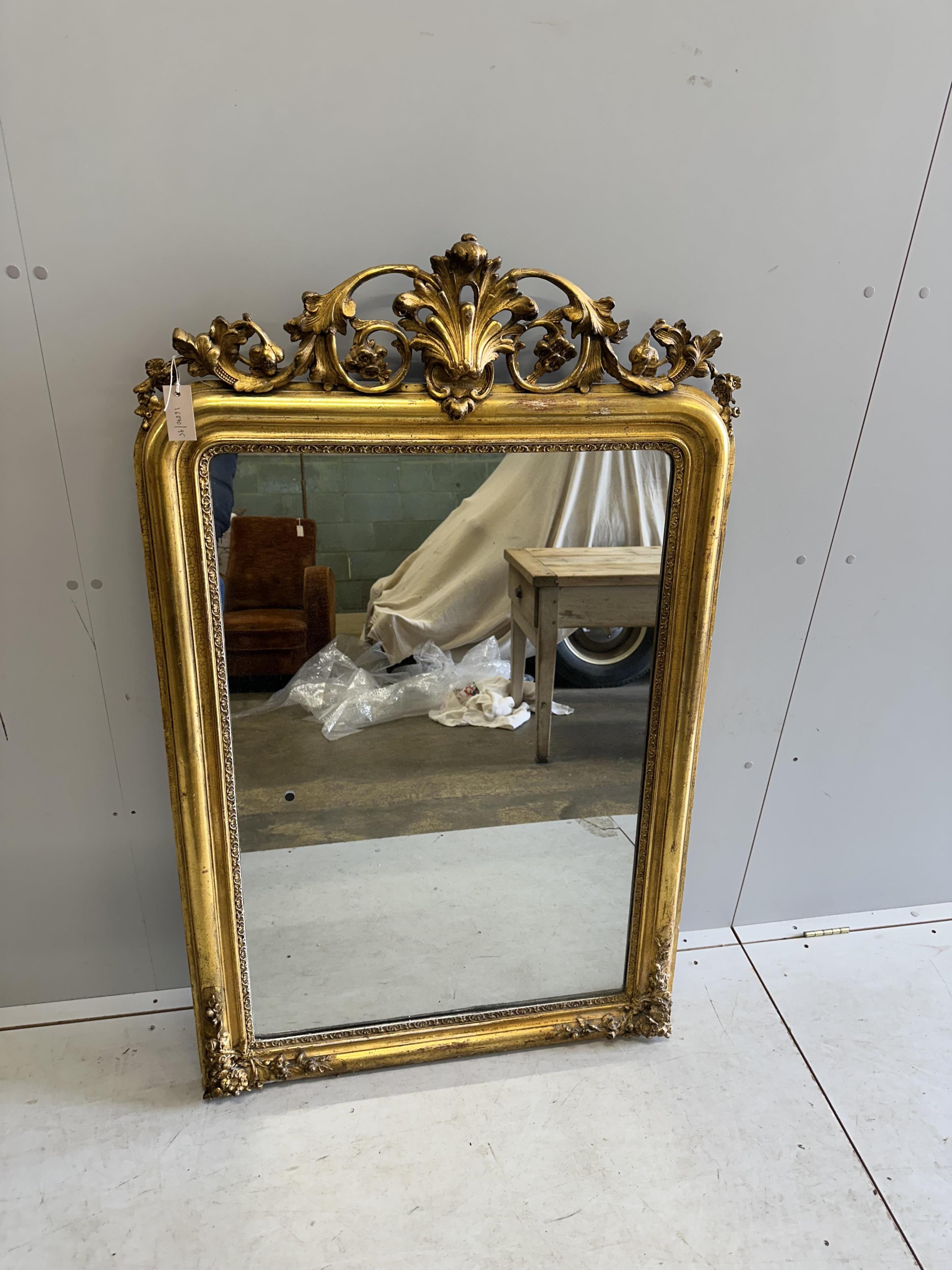 A 19th century French giltwood and composition overmantel mirror, width 88cm, height 140cm. Condition - fair to good